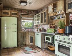 Guest Cottage Kitchen With Mismatched Cabinets And Vintage Inspired Appliances Exposed Brick Kitchen Brick Kitchen Kitchen Cabinets
