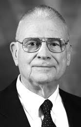 Newly elected commissioner Scotty Miley takes his seat