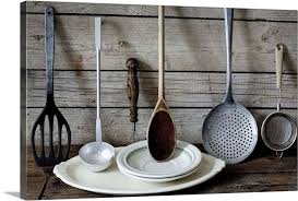 Old Kitchen Utensils And Crockery Against A Wooden Wall Crockery Wooden Walls Old Kitchen