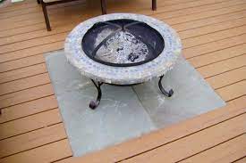The wood deck fire pit comes with a porcelain grate for cooking. Fire Pits Planter Boxes Designer Decks