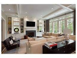 Living Room Metal Frame Armchairs Large Windows Ceiling Beams Built In Bookcase Transit Cozy Living Room Design Built In Around Fireplace Living Room Built Ins