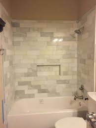 Subway tiles have quite a design history, having been around for an exceptionally long time. Mixed Marble And Textured White Subway Tile Tub Surround Tile Job Tile Tub Tile Tub Surround Tub Surround Tile