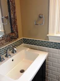 Hexagon tiles in taupe, gray and cream make a darling backsplash for this neutral bathroom's shower and tub. Backsplash Tile Ideas For Bathroom Novocom Top