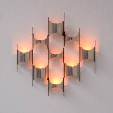 Small candle holders fit beautifully on narrow walls, and larger designs can be artwork by themselves. Sculptural Wall Mounted Candle Holder Vintage Design Point