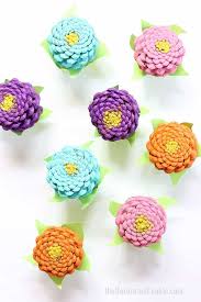 Paige hemmis is showing you how to take ordinary pine cones and turn them into a centerpiece of flowers.get paige's pine cone centerpiece isntructions here: How To Paint Easy Pine Cone Zinneas A Colorful Home Decor Craft Video