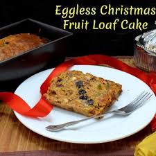 Decorate with a snow shower of mix in the fruit and the rest of the ingredients except for the remaining brandy and icing sugar. Eggless Christmas Fruit Loaf Cake
