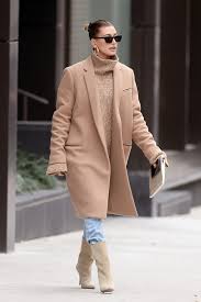 A navy pantsuit, a black top, burgundy boots and a camel coat for a bold work look black denim, a creamy sweater, a camel coat, black sneakers and a bag for a casual feel Hailey Baldwin Spotted After Becoming A Bieber Fitforhealth News