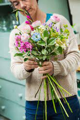 All varieties have been preserved to ensure they will not wilt in the same way living plants would. A Florist Creating A Hand Tied Bunch Of Fresh Flowers Stockphoto
