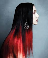 The long red hair has been cut into layers. Tis The Season To Get Creative With Red Be Creative Long Hair Styles Red Hair Tips Hair Styles