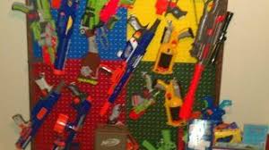 Nerf gun rack is painted in nerf colors. Organizing Nerf Guns In Boy S Room Hometalk