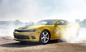 Jumping stunt car drives on two large adjustable wheels, and a piston mechanism on the rear of the car launches it an astonishing 32 inches into the air. Luxury Yellow Sport Car Drifting Motion Capture Stock Photo Picture And Royalty Free Image Image 30596767