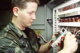 SENIOR AIRMAN Matthew Morris, a facility maintenance team member belonging  to the 448th Missile Squadron at Grand Forks, AFB, N.D., takes a voltage  reading
