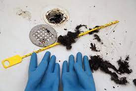 Use a screwdriver to remove the drain guard. How To Unclog A Bathtub Or Shower Drain From Hair