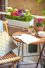 An occasional table's potential is limitless….simply use your imagination! Beautiful Terrace Or Balcony With Small Table Chair And Flowers Stock Photo Picture And Royalty Free Image Image 40624046