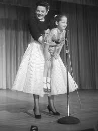Judy garland at 21 singing over the rainbow remastered audio. Judy Garland Holding Up Lorna Luft Her Daughter While She Sings Somewhere Over The Rainbow 1950s Oldschoolcool