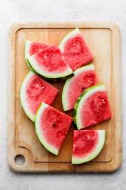 To cut a watermelon, start by slicing off the ends with a sharp knife. How To Cut A Watermelon Step By Step Tutorial Feelgoodfoodie