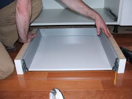 This is great for throwing away things when your hands are full or dirty and you'd rather not dirty up the cabinet door.check out the video to see the mech… How To Add Toe Kick Drawers For More Storage