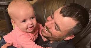 Grieving dad reunited with baby girl after wife and 8 family members  massacred