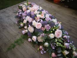 How do you make a casket spray? Pink And Purple Coffin Spray Funeral Flowers Memorial Flowers Funeral Flower Arrangements