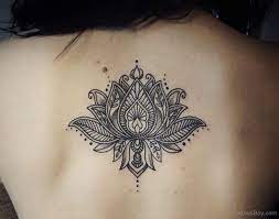 Religious and spiritual ceremonies also make use of it, making it an incredibly popular flower. Unique Black Lotus Flower Tattoo On Girl Upper Back By Caro Voodoo