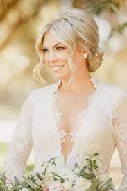 Bridal Hairstyle With Center Part Classic Chignon Bun Wedding Hair Simple Wedding Hair Ideas Bri Elegant Wedding Hair Romantic Wedding Hair Bride Hairstyles