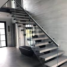 Floating stairs with a clear glass railing lead the way to the home's second level. Top 70 Best Stair Railing Ideas Indoor Staircase Designs
