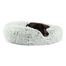 Invest in the shag donut cuddler for your dog to provide him/her with a comfortable place to sleep. The Original Calming Donut Dog Bed In Shag Fur 30 X30