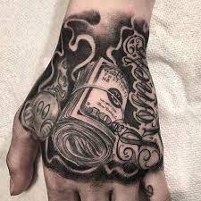 People get them for all sorts of reasons, and their popularity spans people of all ages.but the one thing tattoos have in common is they symbolize meaning for the person with the tattoo. 101 Best Money Tattoos For Men Cool Designs Ideas 2019 Guide Hand Tattoos For Guys Tattoos For Guys Money Tattoo