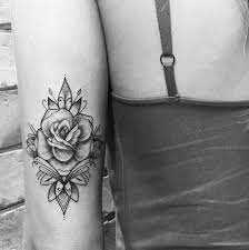 Black And White Rose Tattoo On The Back Of The Arm Rose Tattoos For Women Tattoo Arm Designs Neck Tattoo