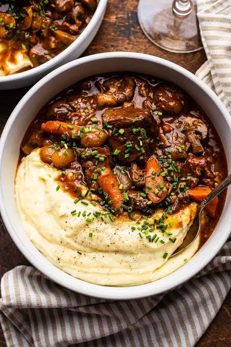 Traditional Beef Bourguignon with pearl onions and mushrooms, AI generated
