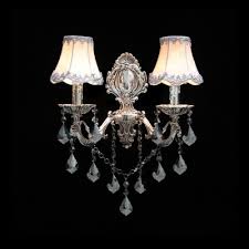 This lighting is commonly found in many homes as they are versatile. Classic European Style Two Light Wall Sconce Features Elaborate Silver Finish Plate And White Fabric Bell Shades Beautifulhalo Com