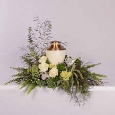We offer the best selection of sympathy and funeral flowers in the rochester ny area. Green And White Cremation Urn By Floral Art Designs