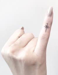 Finger Tattoos Tattoo Insider Finger Tattoos Pinky Tattoo Star Tattoos