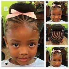 15 Adorable Braided Buns For Little Girls Afrocosmopolitan Little Black Girls Braids Flower Girl Hairstyles Girls Hairstyles Braids
