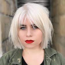 Platinum Choppy Bob With Parted Fringe Bangs And Undone Straight Texture The Latest Hairstyles For Men And Women 2020 Hairstyleology White Blonde Bob White Blonde Hair Bob Hairstyles For Round Face