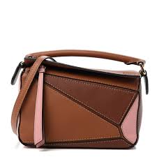 It's about time i make a video about it. Loewe Calfskin Mini Puzzle Bag Tan Medium Pink 733198 Fashionphile