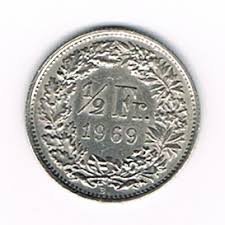 La pièce de 1 franc suisse de l'année. Piece De Monnaie 1 2 Francs Suisse Helvetia Annee De Frappe 1969 B Tranche Cannelee Description Couronne De Fleurs Et De Divers Feuilles De Chene Des Alpes Villers Collections