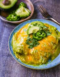 Once chicken is cooked and diced, combine with one package of swiss cheese in separate bowl. Chicken Enchiladas Suizas Modern Honey