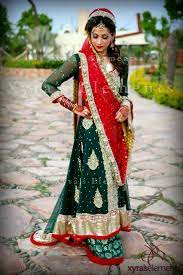 Both The Shades Of Green And Red Are Those Which I Like The Least But This Does Look Good On T Pakistani Bridal Dresses Pakistani Outfits Pakistani Bridal Wear