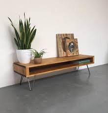 This Interior Design Showroom Boasts The Best Of Mid Century Design In 2020 Narrow Side Table Rustic Industrial Coffee Table Tv Stand Wood