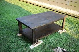 A coffee table is a low table designed to be placed in a sitting area for convenient support of beverages, remote controls, magazines, books (especially large, illustrated coffee table books), decorative objects, and other small items. Diy Rustic X Coffee Table Plans By Ana White Handmade With Ashley