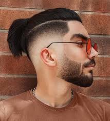 The man bun fade is a prevalent option, as it's basically an undercut which fades from short to long at the sides and back, but leaves a considerable amount of length on top to complete the man bun. 50 Low Fade Haircuts For Men Who Want To Stand Out