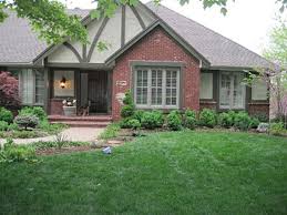We were thinking of changing our columns for stained wood posts. 54 Exterior Paint Color Ideas With Red Brick Roundecor Brick Exterior House House Paint Exterior Red Brick House Exterior