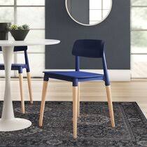 Dining room with table, chairs, sideboard, curtains, wall tapestry, sofa, side table, trunk, carpet, pictures and various decorative, all in bright and bright colors, with decorations of mandalas and different ethnic motifs, to achieve a pleasant boho chic atmosphere. Modern Bohemian Dining Chairs Allmodern