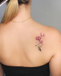 Orchids Tattoo On The Right Shoulder Blade Shoulder Blade Tattoo Small Shoulder Tattoos Blade Tattoo