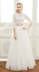 A chic modern bridal separate with a white sequin crop top with long sleeves and a plain pencil skirt. 70 Best Two Piece Wedding Dress Ideas Two Piece Wedding Dress Wedding Dresses Bridal Gowns