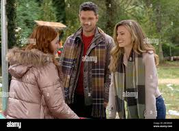 A FABLED HOLIDAY, from left: Daphne Hoskins, Ryan Paevey, Brooke DOrsay,  (aired Dec. 7, 2022). photo: Marcel Williams  ©Hallmark Channel  Courtesy  Everett Collection Stock Photo - Alamy
