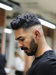 The skin fade is a type of haircut that tapers on the sides and back, blending short faded hair into the skin. Wavy Quiff Mid Skin Fade Haircut Style Guide Regal Gentleman