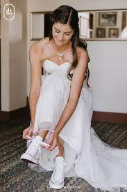 Would You Wear White Converse With Your Wedding Dress We Think This Bride Rocked It View More Photos Of Her Wedding Da Wedding Dresses Bride Converse Dresses
