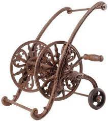 The removable center post helps guide the water hose when you are coiling and uncoiling for use. Ornamental Garden Hose Holder Garden Hose Holder Garden Hose Reel Lawn And Garden